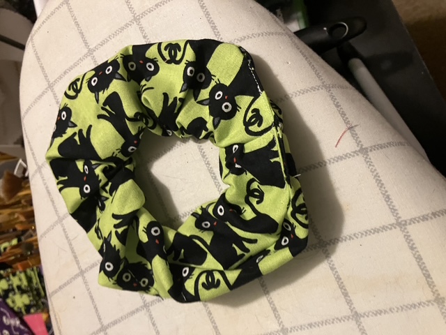 A scrunchie with cats on it