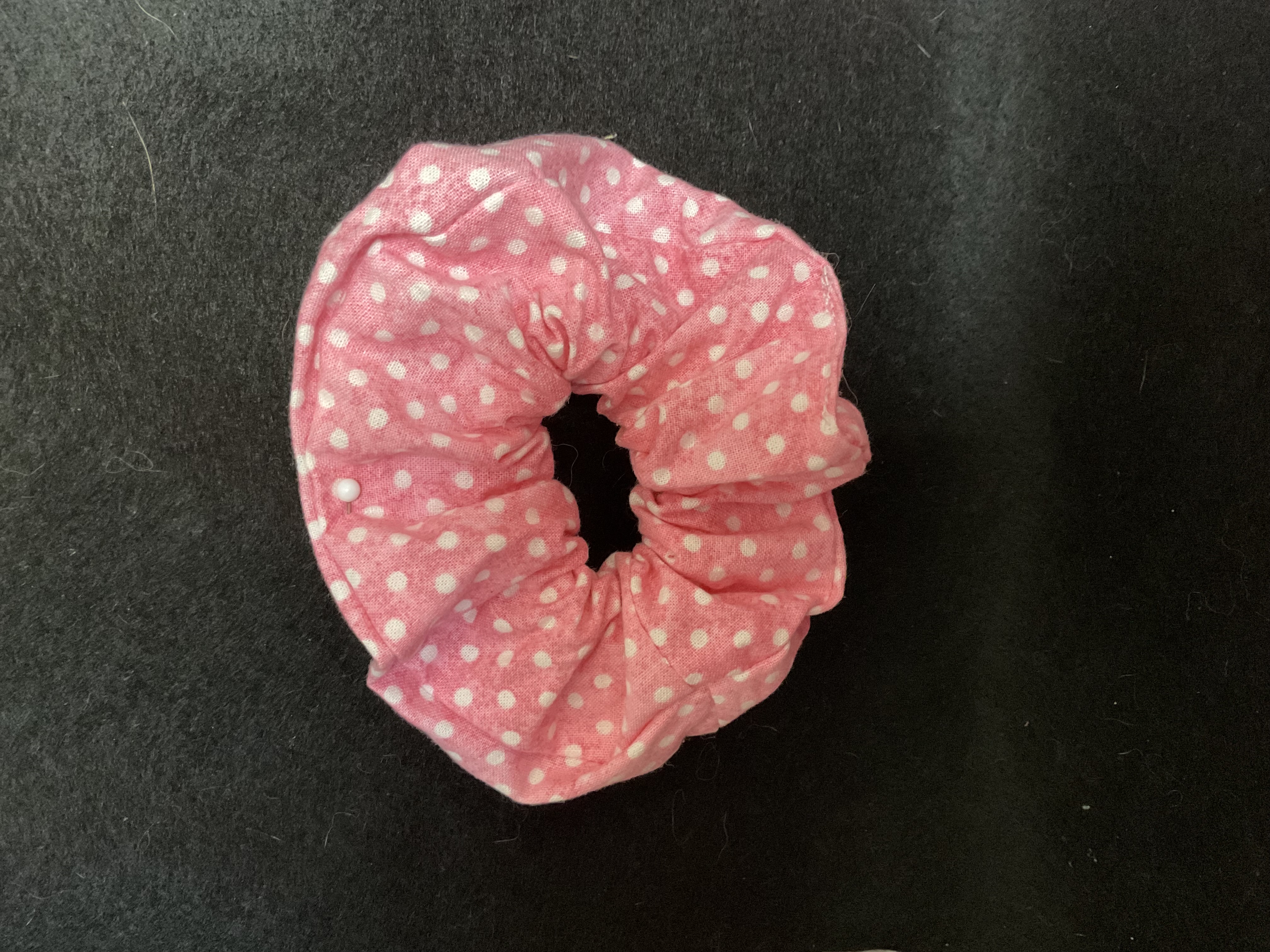 A pink polka-dot scrunchie